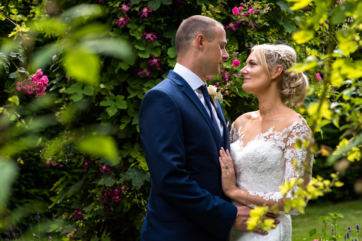 Paul and Lexy photographed togetehr in the Italian Gardens at Kent wedding venue Allington Castle