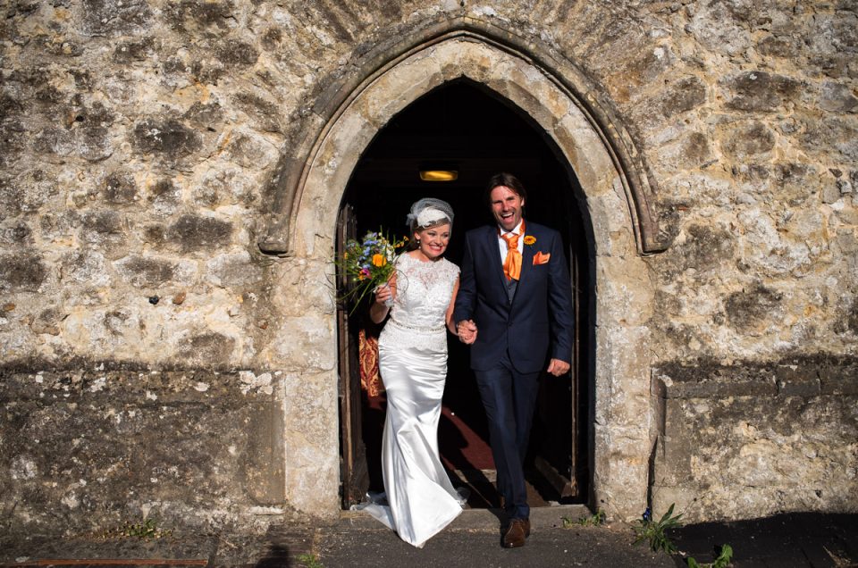 Photograph of John and Ania as they leave the church after their wedding ceremony