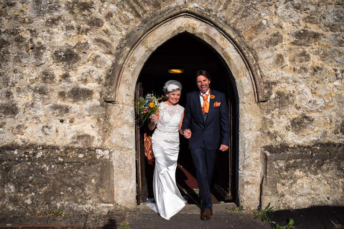 Photograph of John and Ania as they leave the church after their wedding ceremony