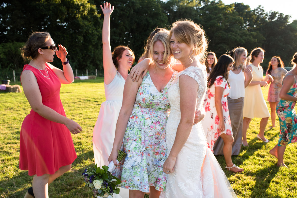 Becky congratulates her friend after she catches her wedding bouquet