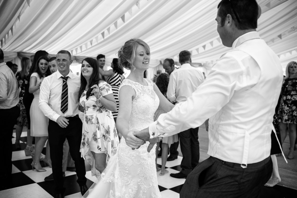 Black and white photograph of Kif and Becky during their wedding first dance