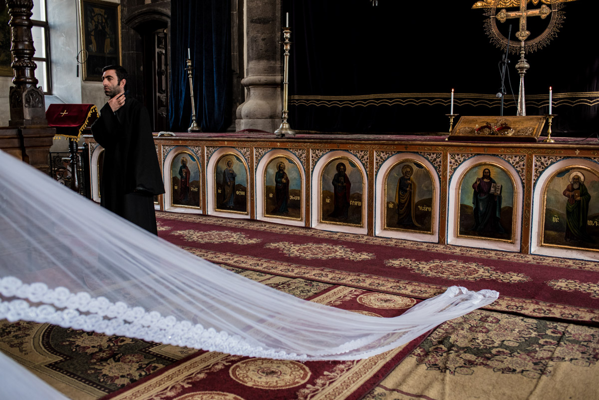 photograph of brides veil in armenian church during her wedding ceremony