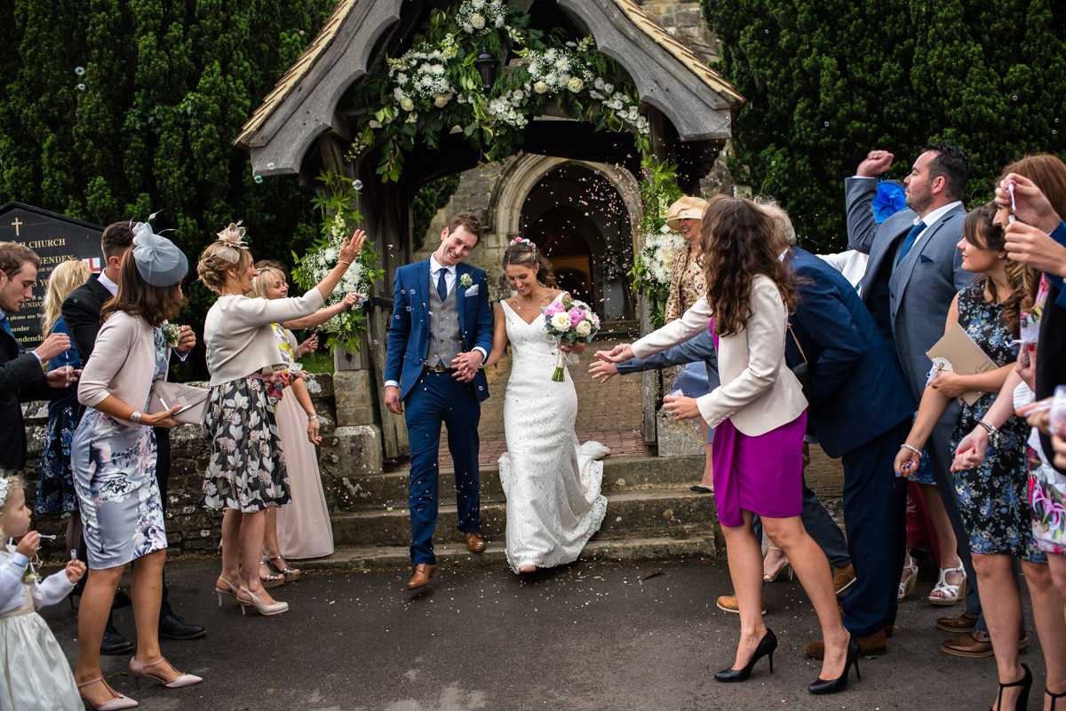 The confetti wedding photograph is always a favourite and this shows Ellie and James as they exit the church