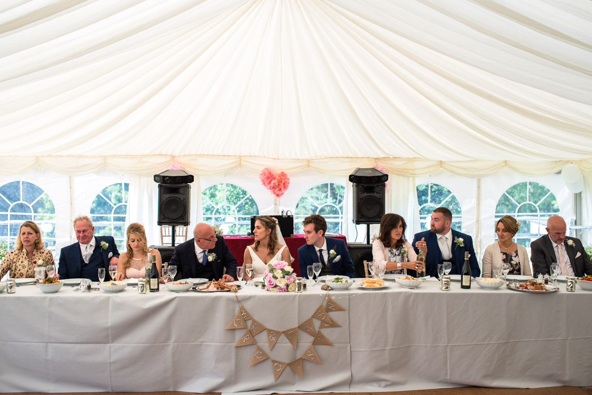 Photograph of the wedding party at Ellie and James Kent wedding reception