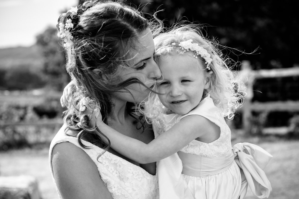 Black and white photograph of Ellie and her flower girl
