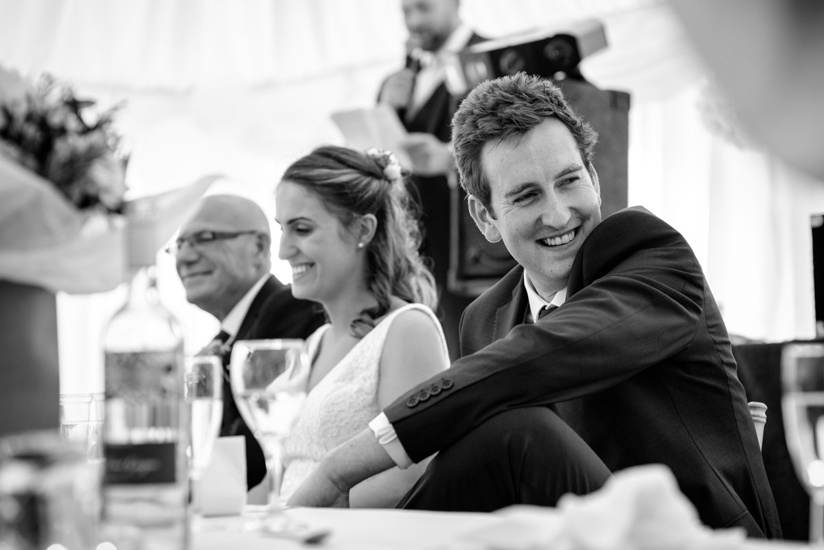 James is photographed during the best mans speech at the marquee reception in the Kent countryside