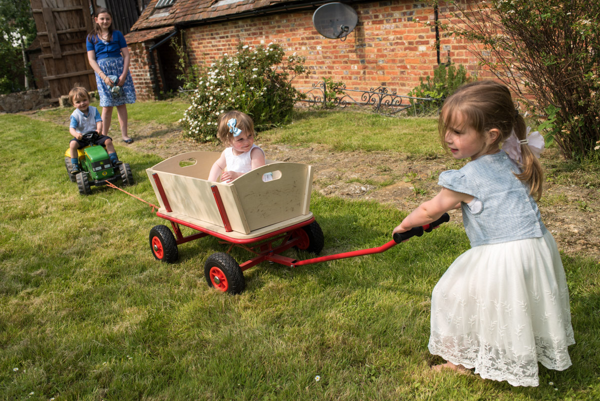 Children are photographed in wooden trailer after Kent christening
