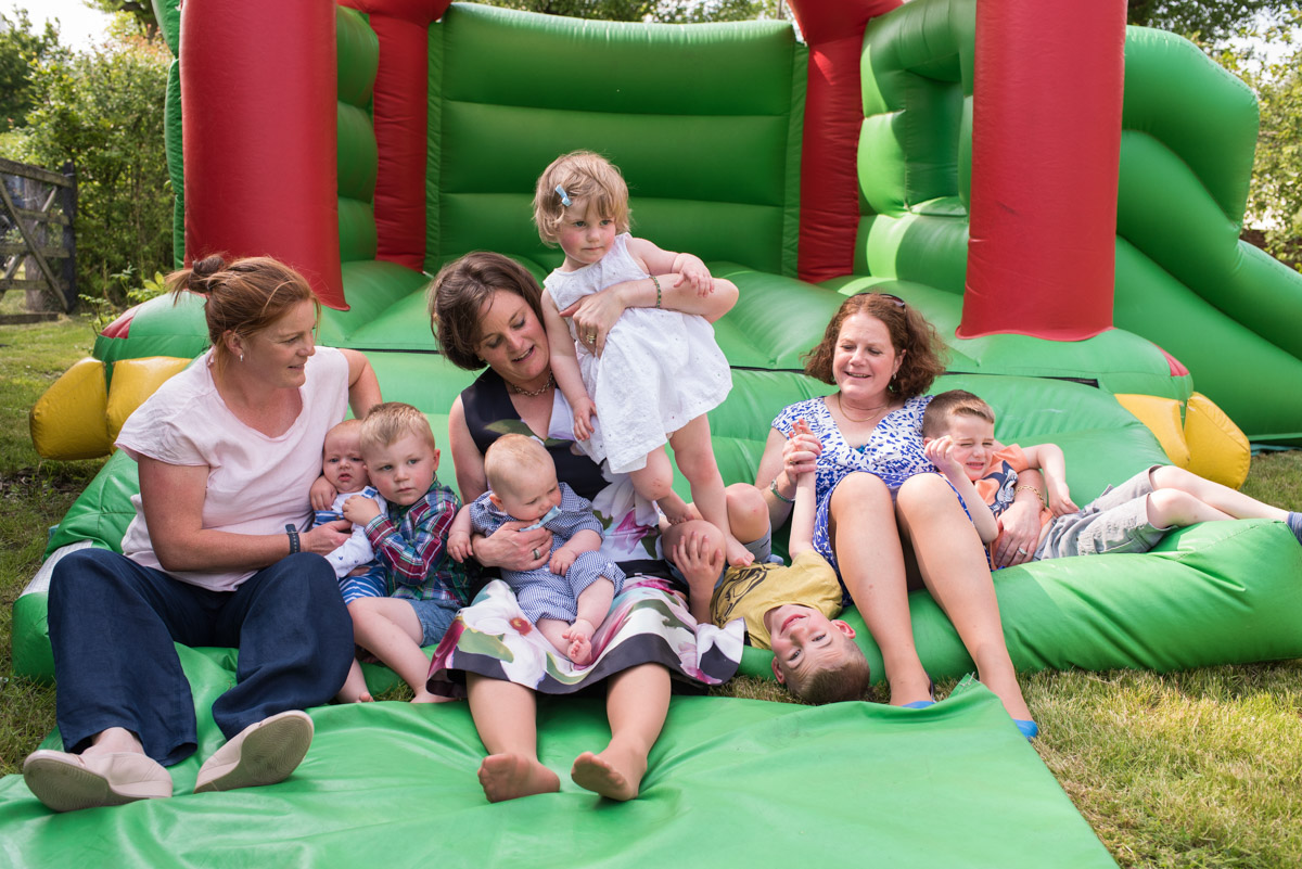 The Challis girls and their children are photographed on bouncy castle