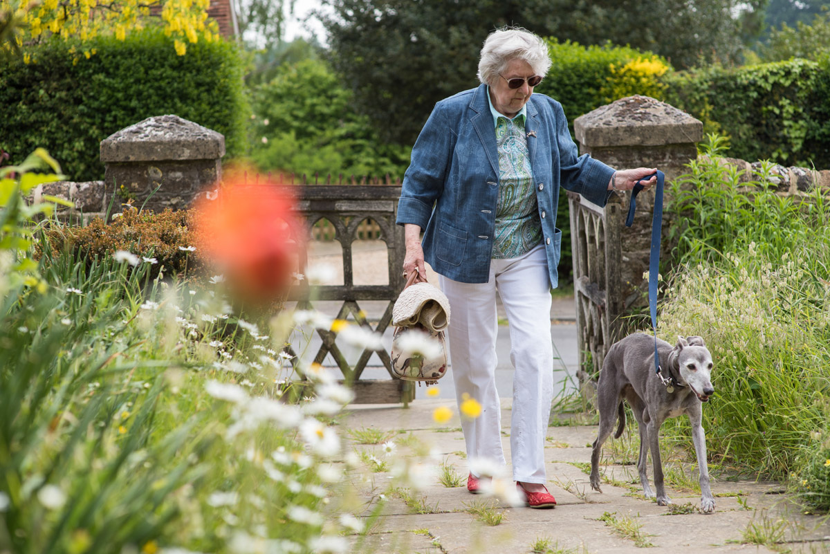 Guest and her dog photographed arriving for Edwards Christening in Kent church