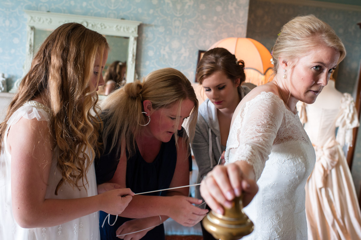 Andrea and bridesmaids photographed getting ready at Boughton Monchelsea Place in kent