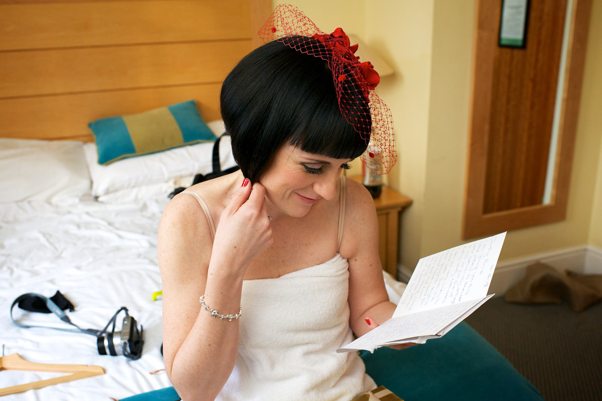 Photograph of Anna reading her latter from Robbie before her London civil partnership