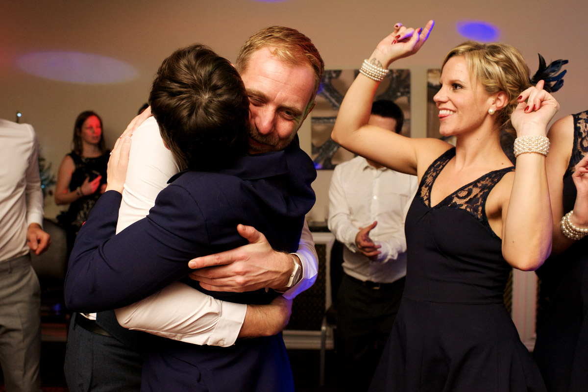 Robbie is hugged by a guest at her civil partnership reception party