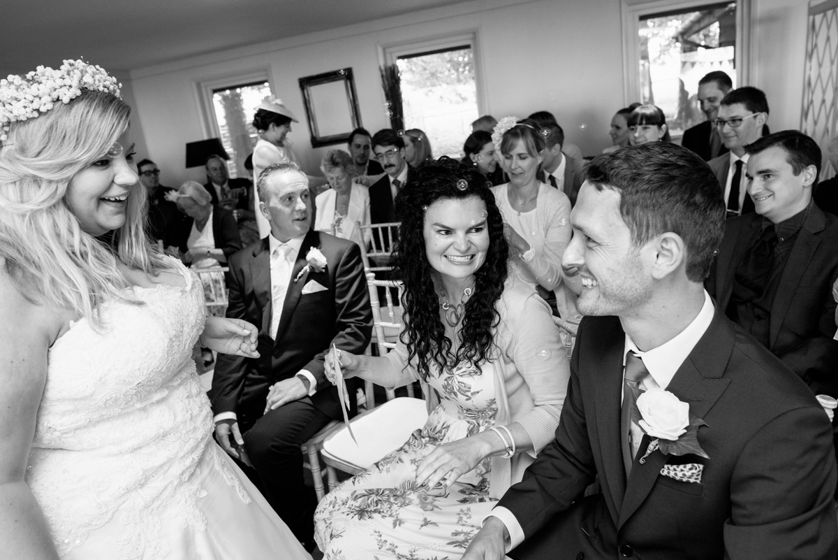 Stevie shares a joke with her friends on her wedding day in Wye, Kent