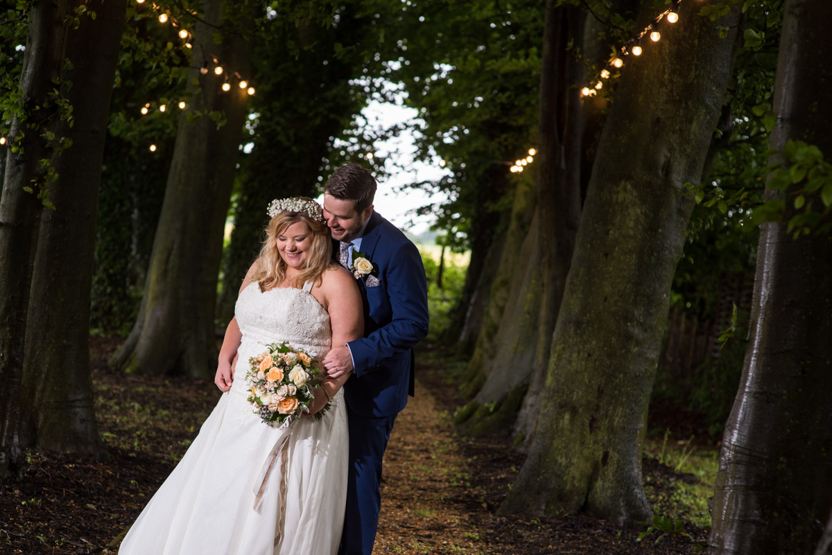 Off camera flash lights this wedding portrait of Lee and Stevie on their wedding day in Kent