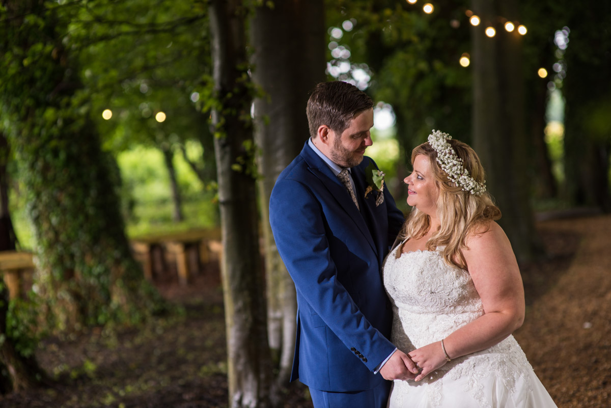 Photograph of Lee and Stevie in the woods at Crown Lodge in Kent on their wedding day