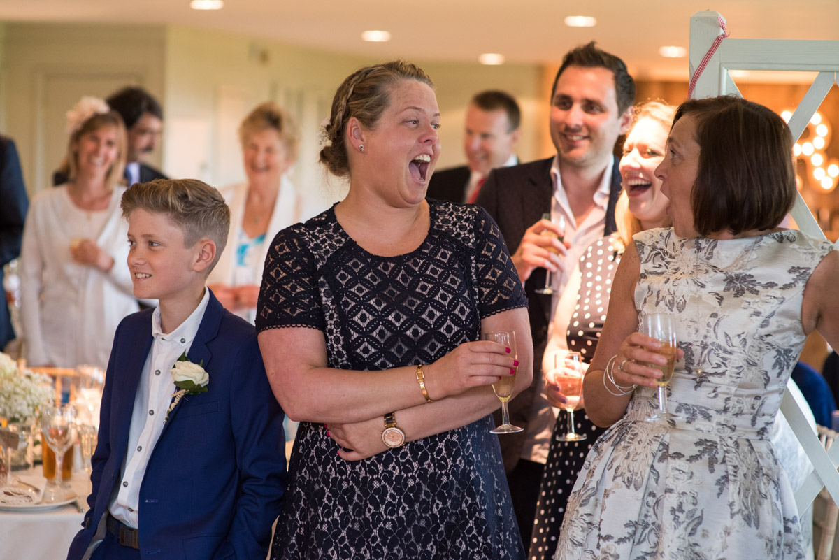 Lee's sister laughs at the wedding speeches at Crown Lodge in Kent