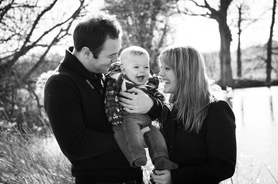Black and white photo of Hannah and David and baby on their engagement photoshoot