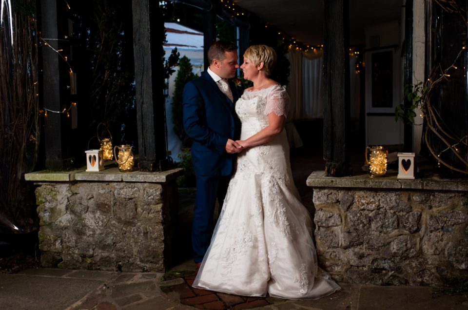 Off camera flash lit photograph of bride and groom at Hayne Barn House