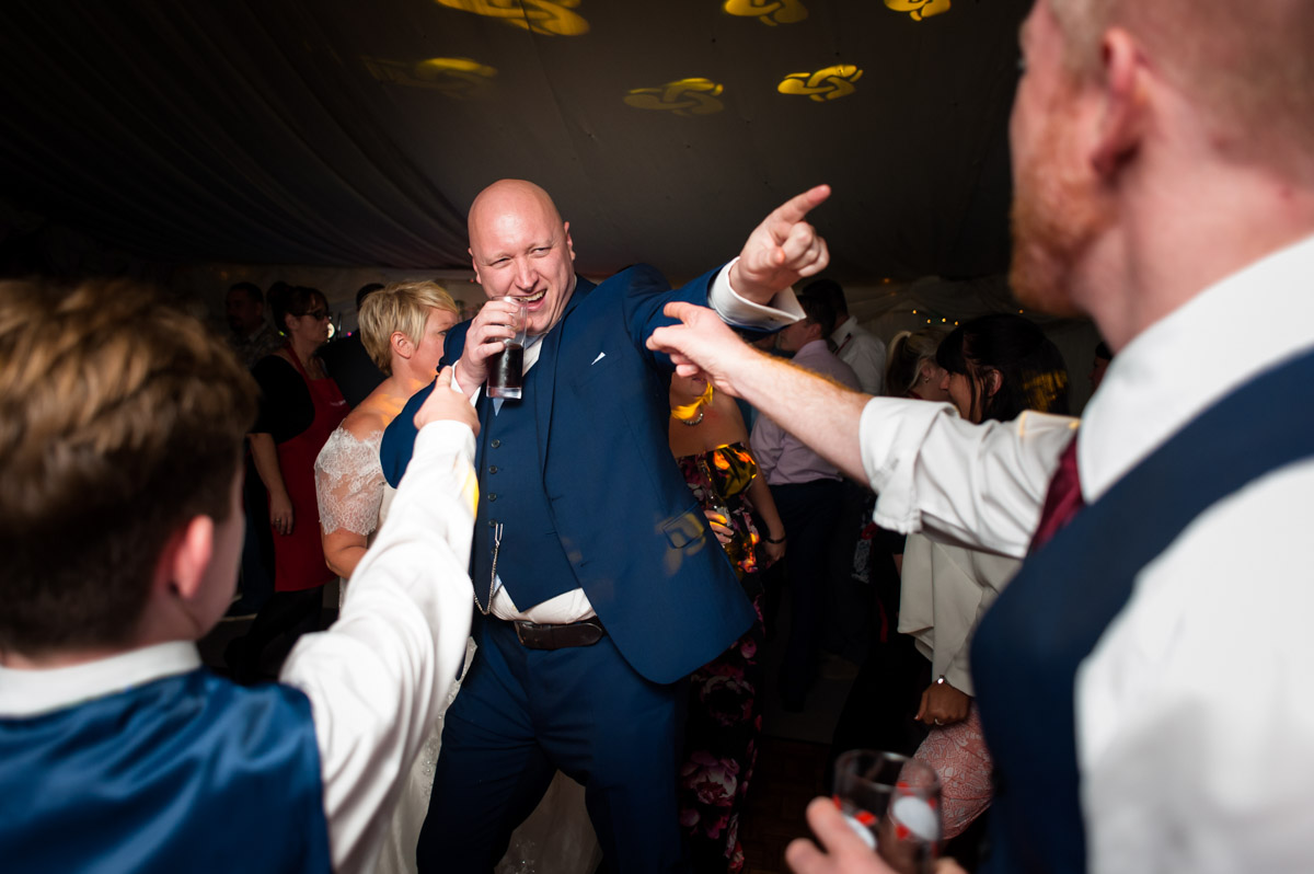 Photograph of wedding guesyts on dance floor at Kelly and Stuarts Hayne Barn House wedding