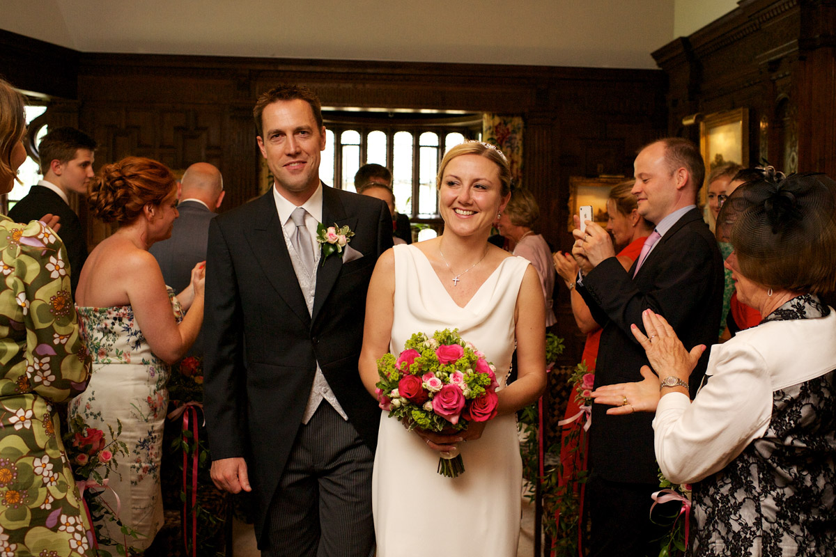 gail and john walk down the sale after their wedding ceremony at hever castle in kent