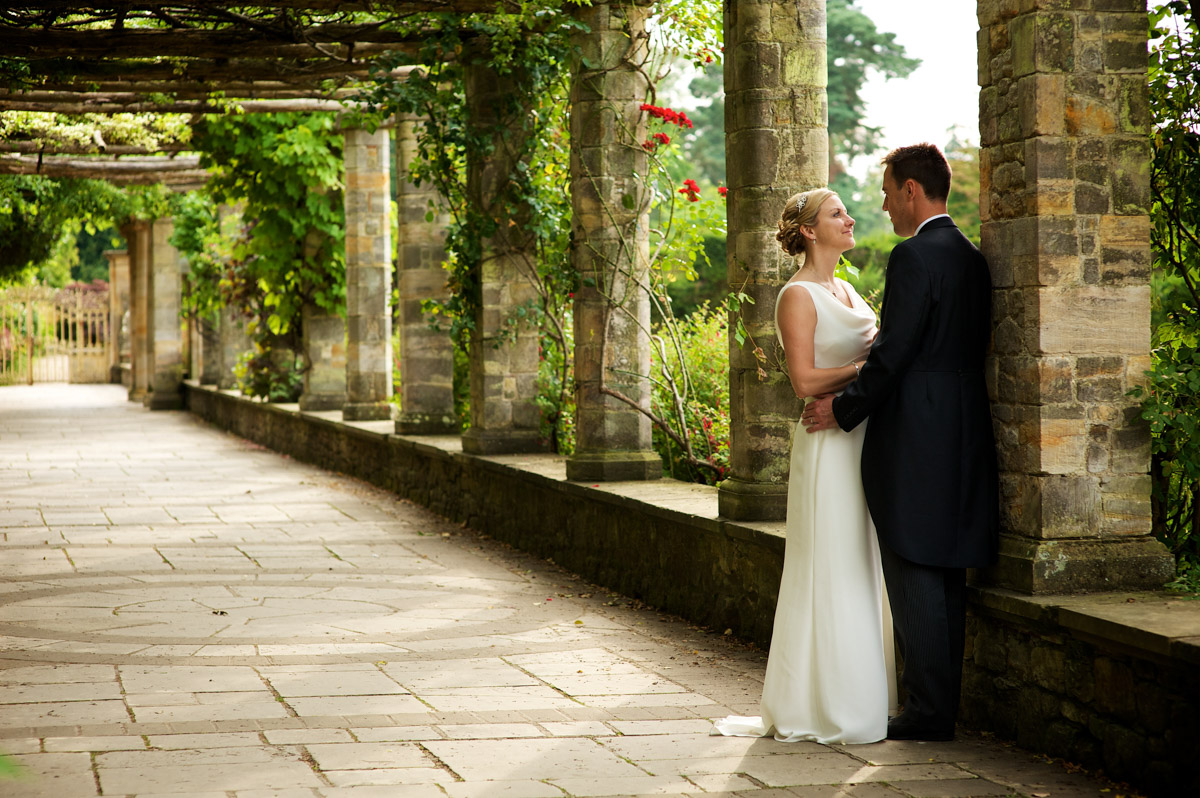 john and gail are photographed together in the italian gardens at never castle after their wedding ceremony
