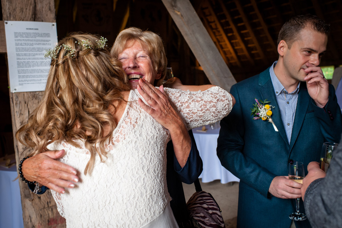 wedding photography at rats bury Barn, guests and Corinne celebrate