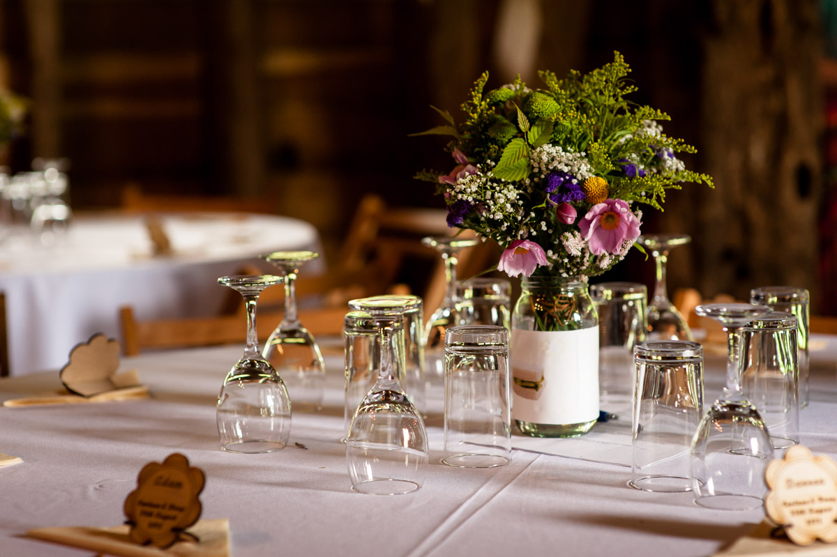 Table decorations at Corinne and Dougs wedding at Ratsbury barn in Tenterden, Kent