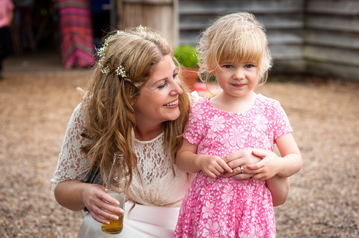 Little girl and bride at Ratsbury barn in Kent