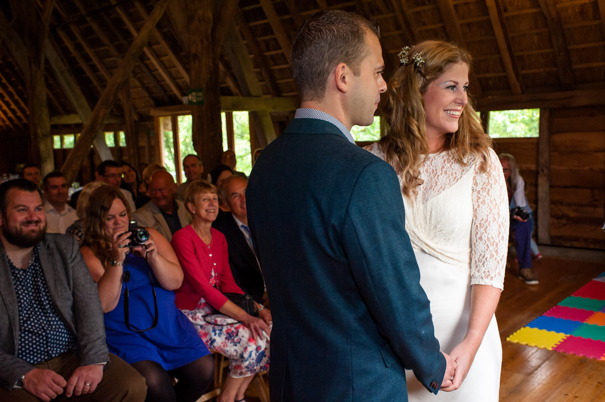 Photograph of Doug and Corinne taking their wedding vows at rats bury Barn in Kent