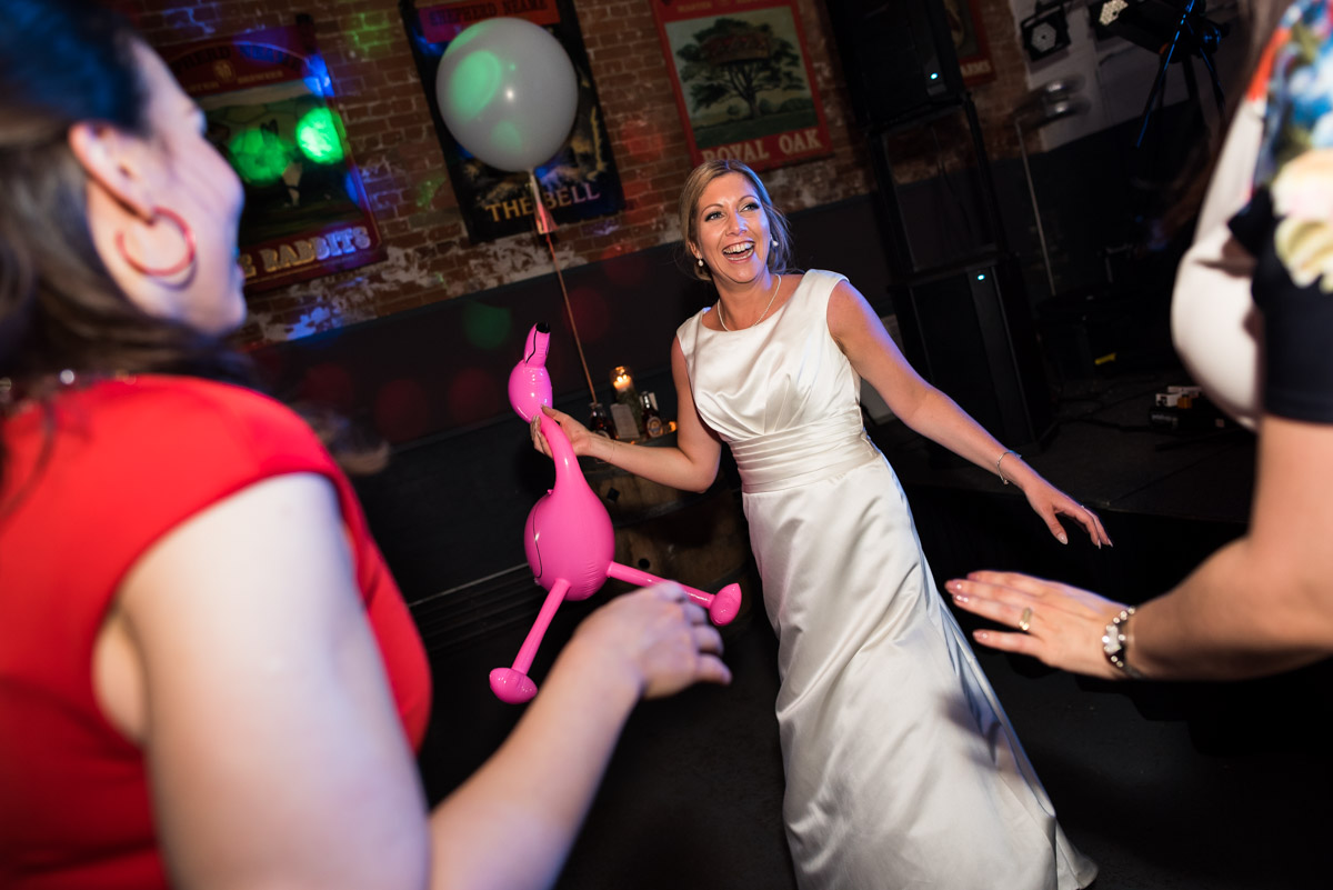 Louise is photographed clutching a blow up flamingo on the dance floor