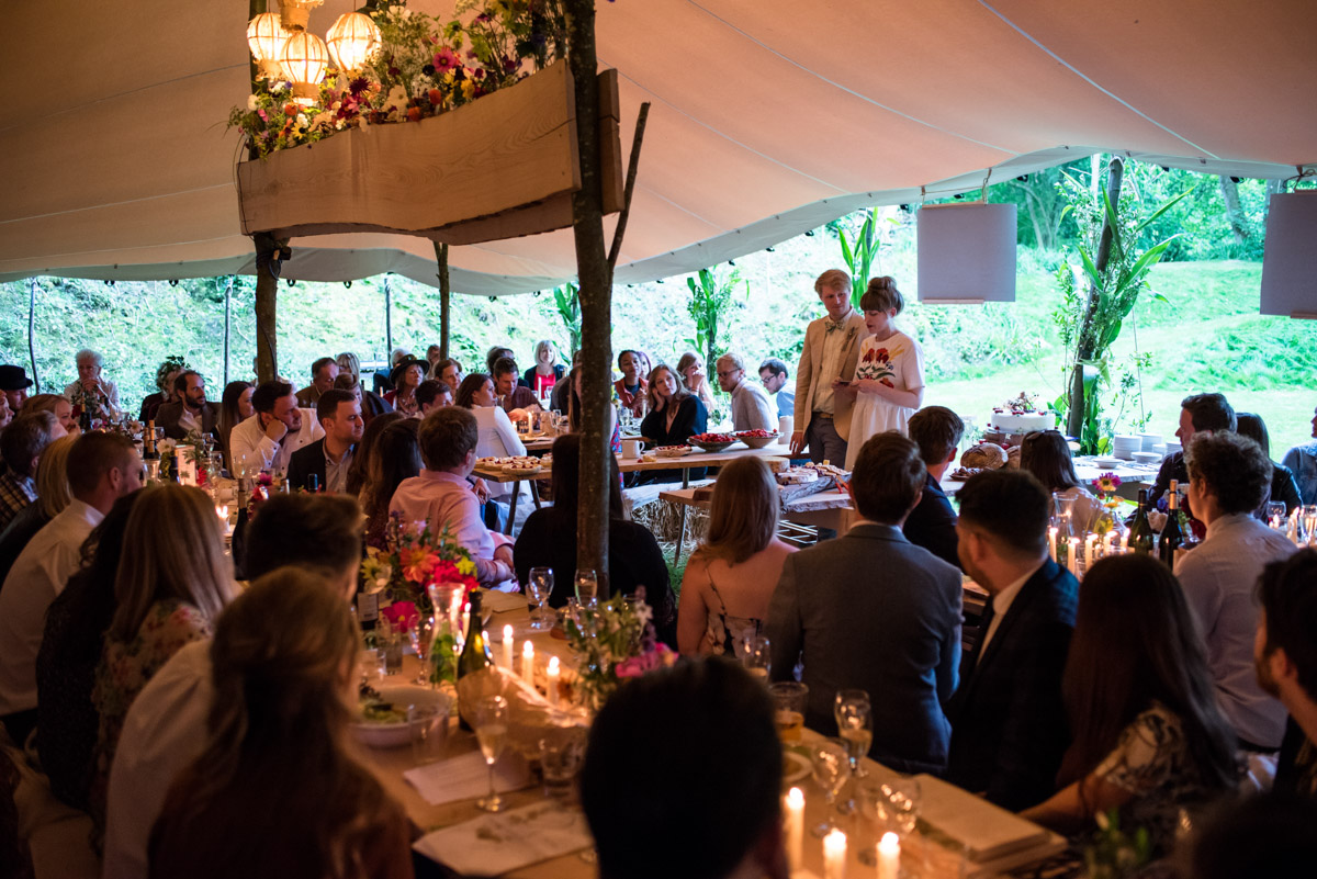 Photograph of guests and Brogan and Seb making their speech at their wedding party