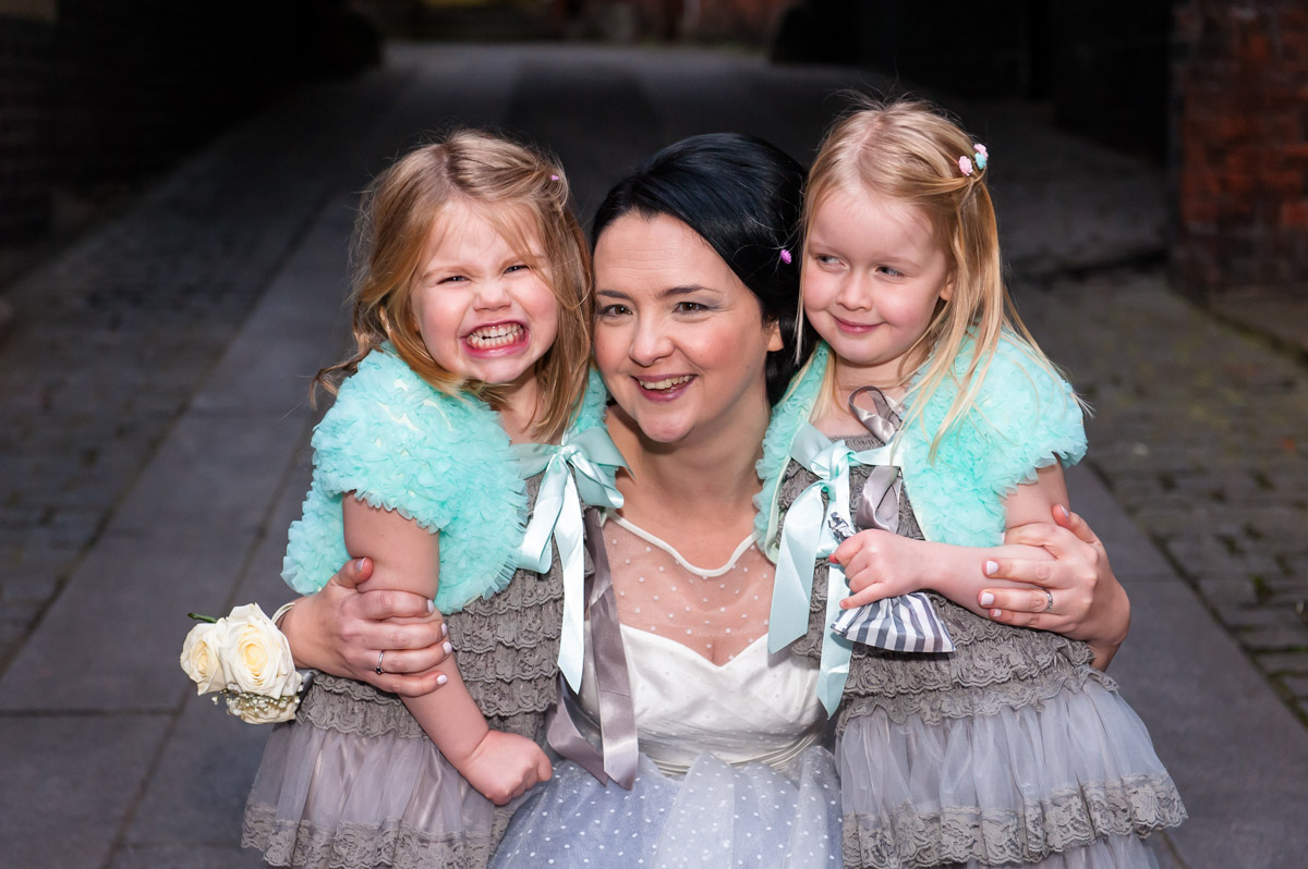 Laura has photograph with flower girls on her wedding day