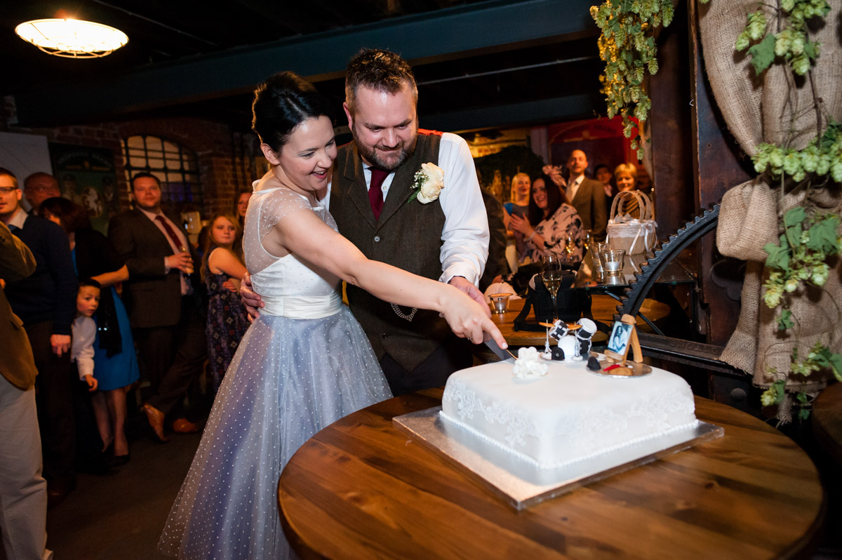 Photograph of cake cutting at Laura and Daniels wedding in Kent