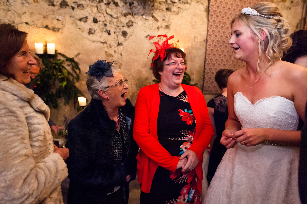 Photographer captures the laughter between Sara and her wedding guests
