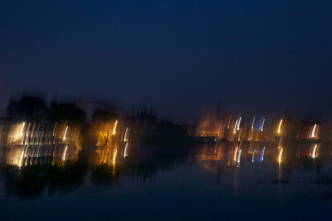 Blurred image of lake in Varanasi, India at night