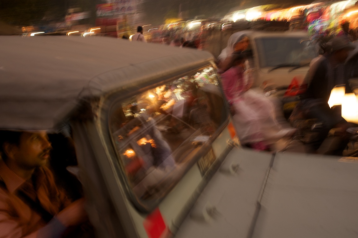 man driving jeep on chaotic streets of Varanasi