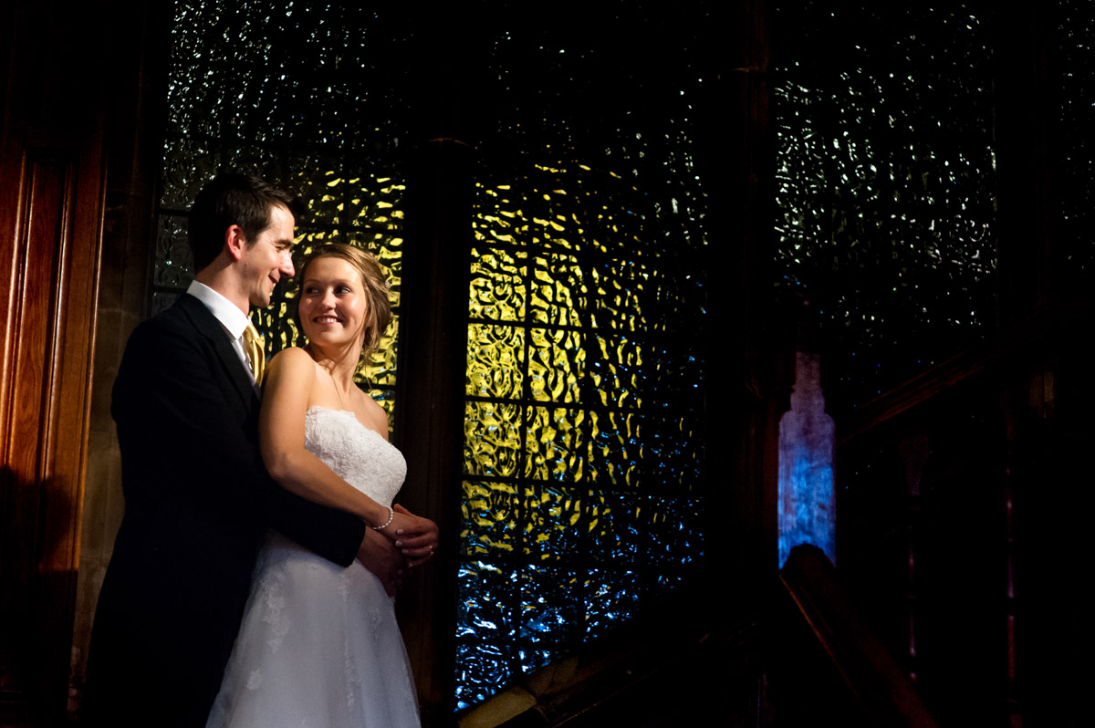 Night portrait of Abigail and Peter on stairs at their Kent wedding reception