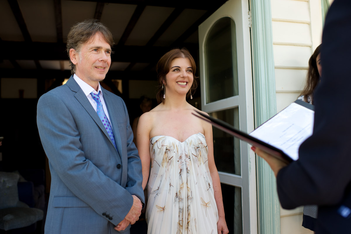 naomi and martin take their wedding vows outside at the artists beach house in whitstable kent