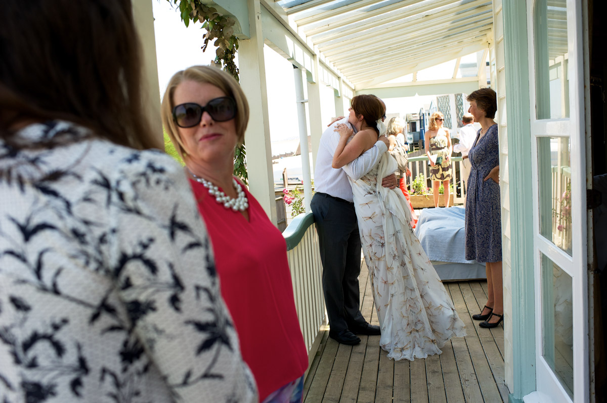 naomi hugs wedding guests at her wedding at the artists beach house in ket