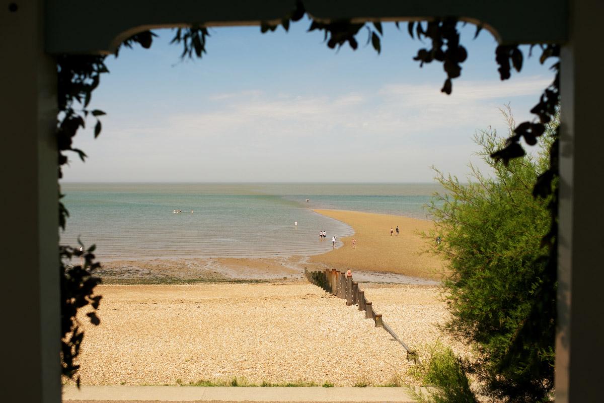 view of the beach from the artists beach house in kent on hot summer day