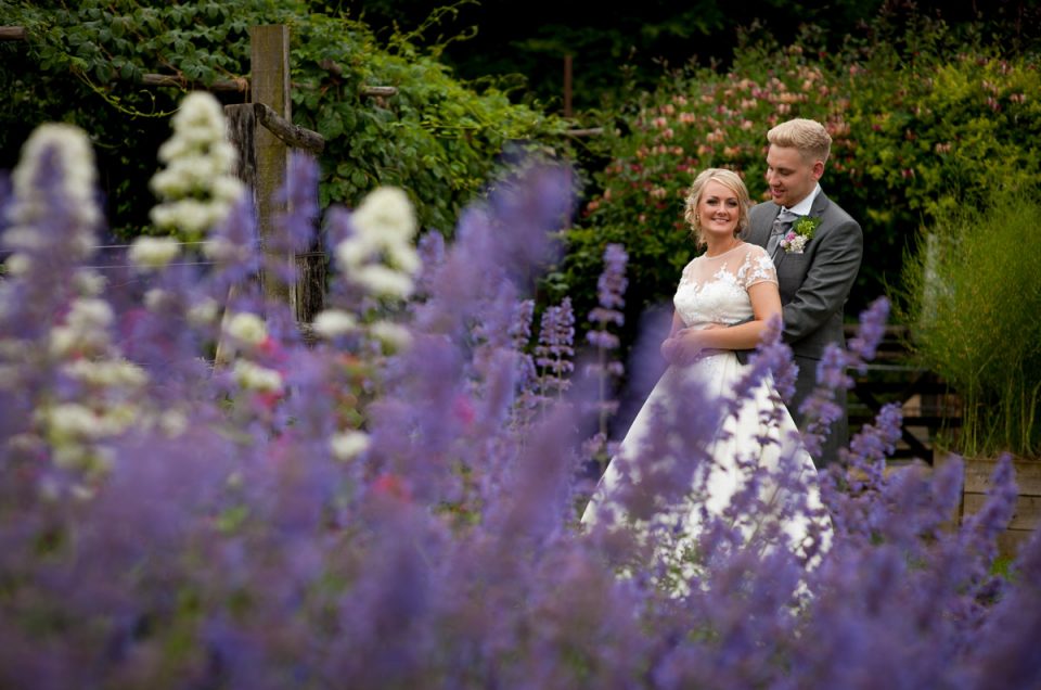 Portrait photograph of wedding couple in gardens at Rare Breeds Centre