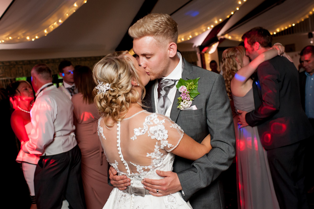 Wedding couple kiss during first dance