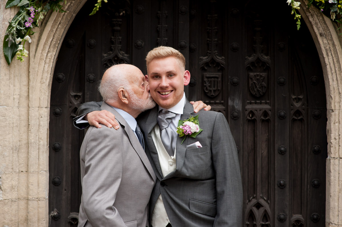 Photo of groom and his grandad outside church