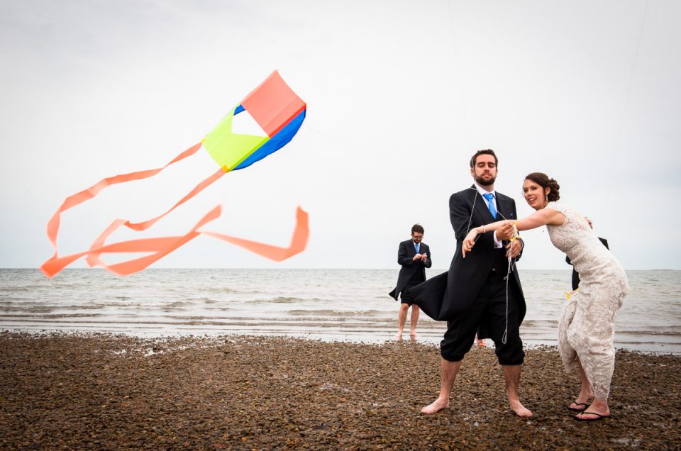 Andy and Emma photographed on their wedding day in the sea in Whitstable in Kent