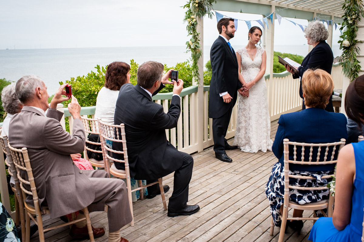 Bride and Groom get married outside at The Beacon House
