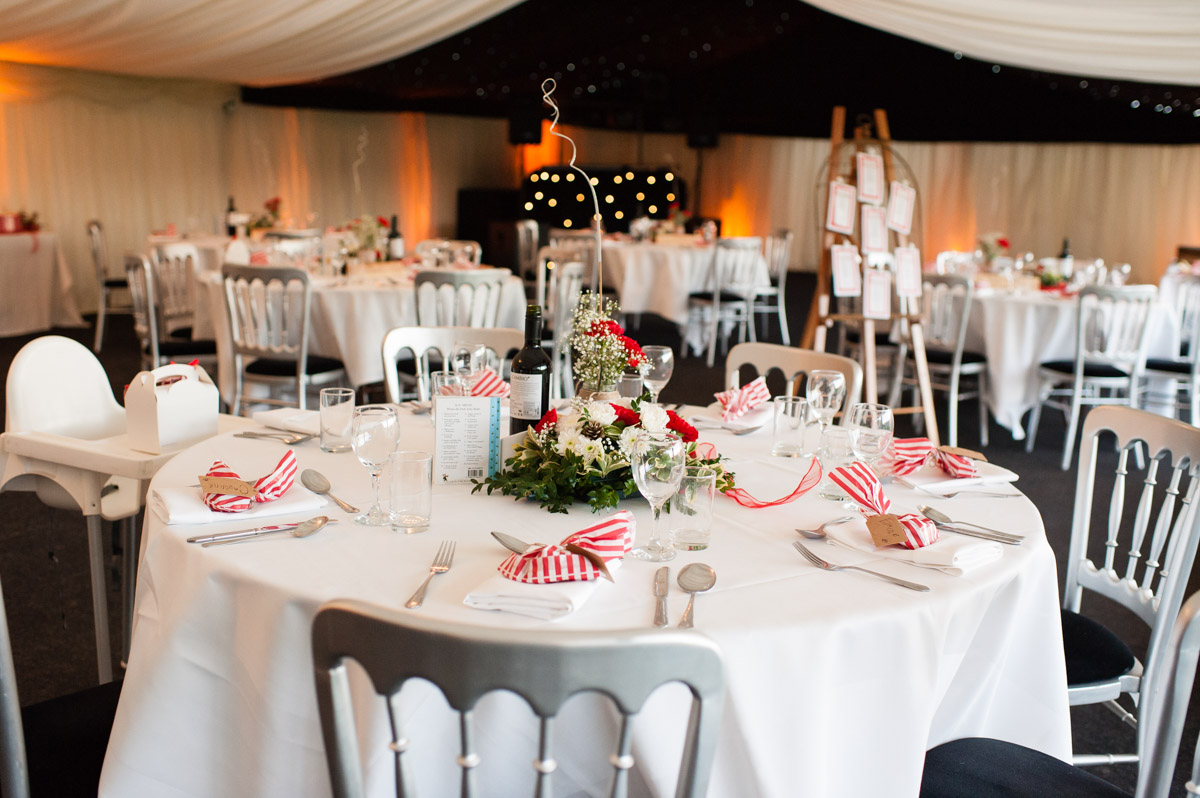 wedding tables and decorations at mark and charlottes wedding reception in marquee at Nursted court in kent