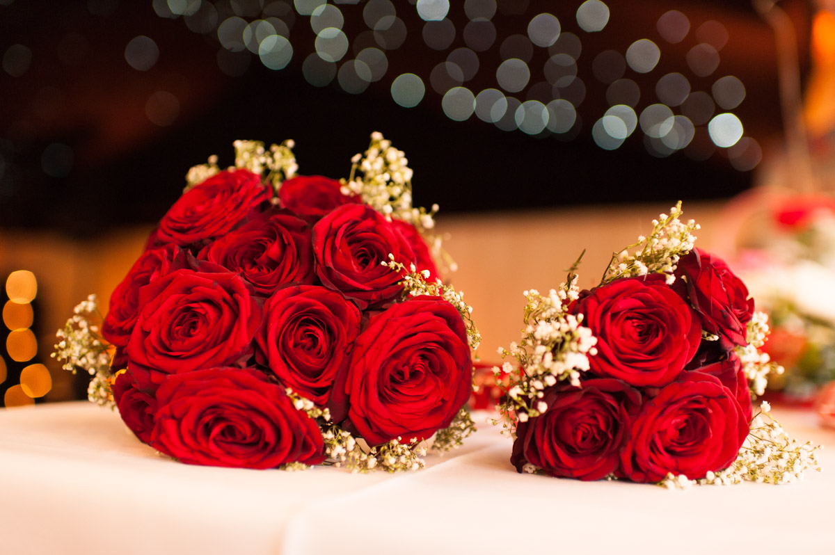 photograph of red rose wedding bouquet