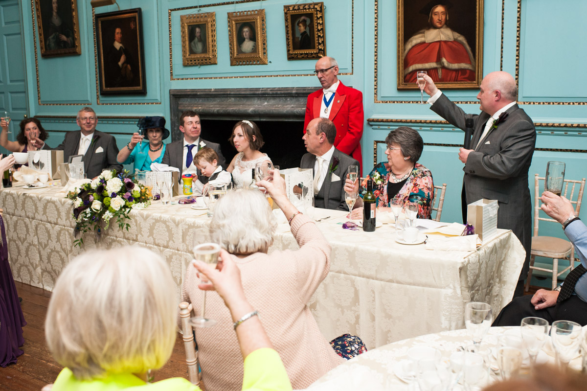 Best man toasts the bride and groom after his speech at Bradbourne House