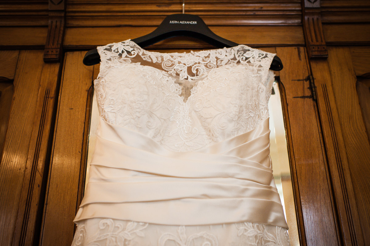 Photograph of wedding dress hanging on the wardrobe at Bradbourne House