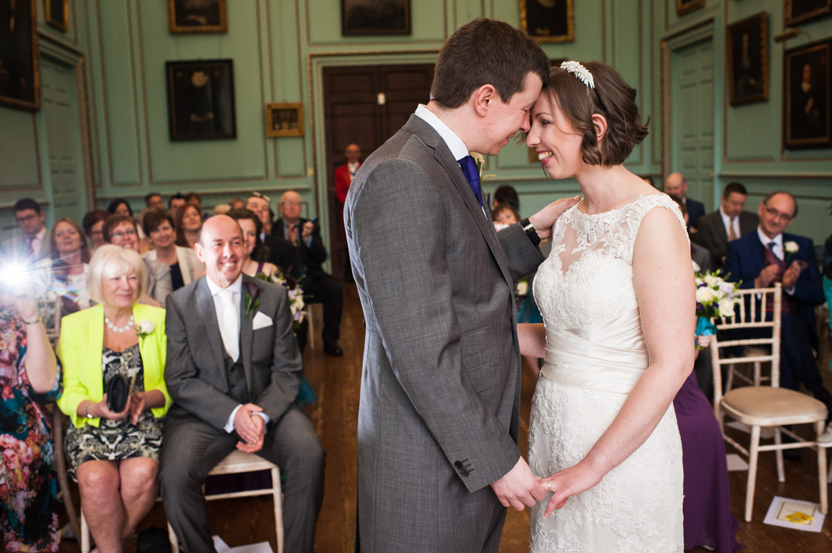 The bride and groom gaze into each other's eyes at the end of their marriage ceremony at Bradbourne House